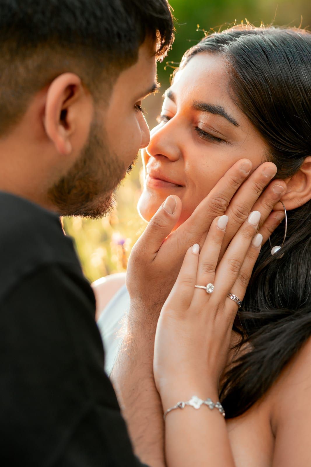 Pooja and Barun at golden hour in Florence, just after the proposal, his hand cupping her face